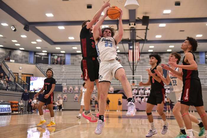 Edmond North senior Dylan Warlick fights for the ball during a recent game. Warlick attempts to lead the Huskies to a third straight Class 6A state title this week.